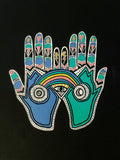 Colorful hand with palm open, featuring symbols like an eye and rainbow on a black background.