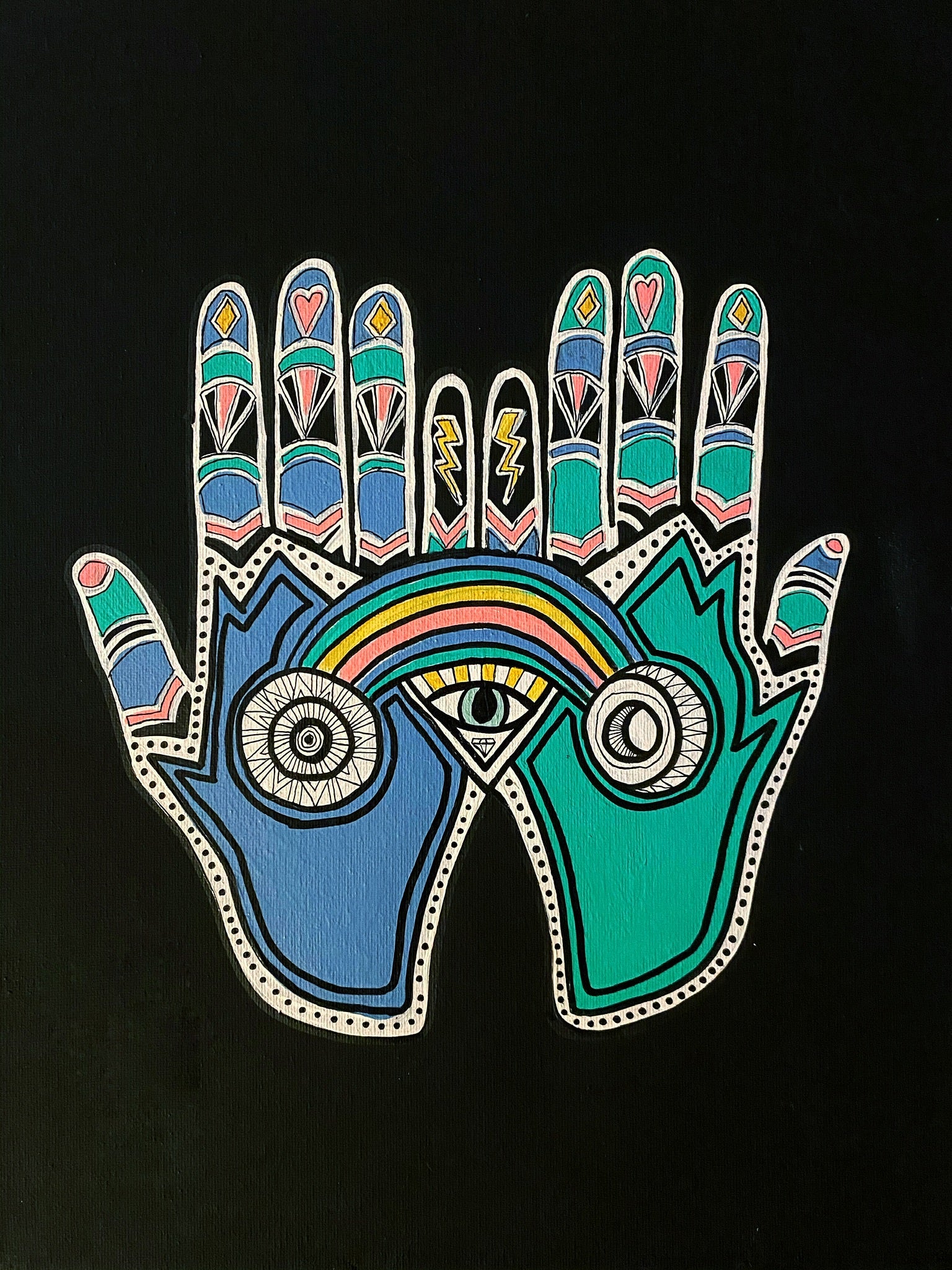 Colorful hand with palm open, featuring symbols like an eye and rainbow on a black background.