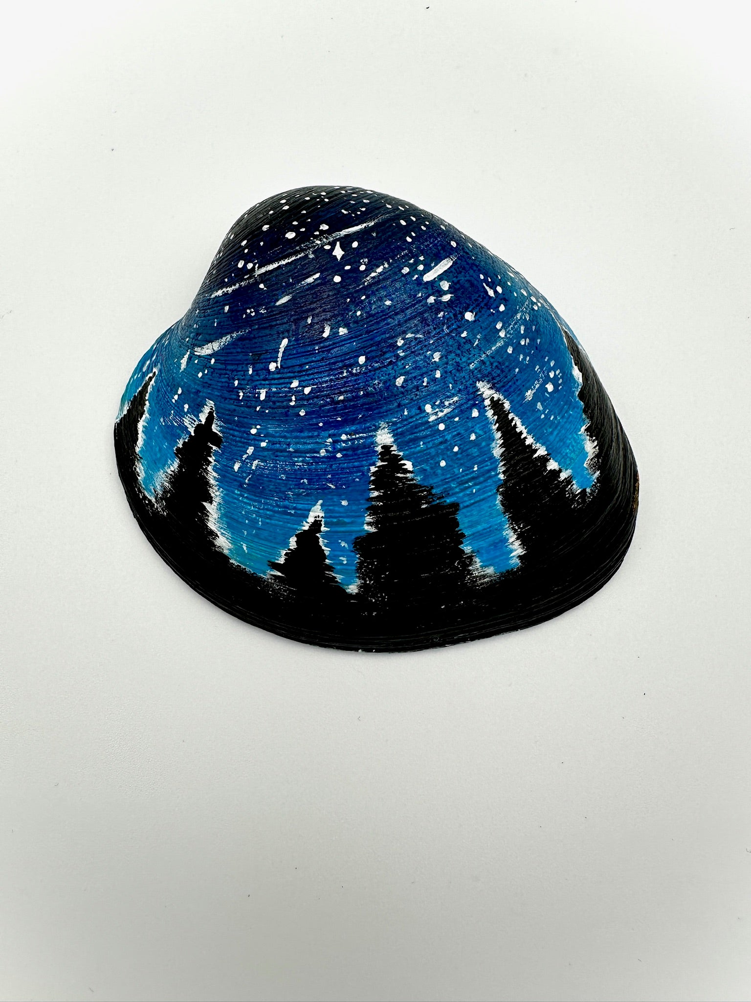 Decorative item with a night sky and tree design on a white background