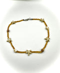 Starfish bracelet with brown beads on a white background