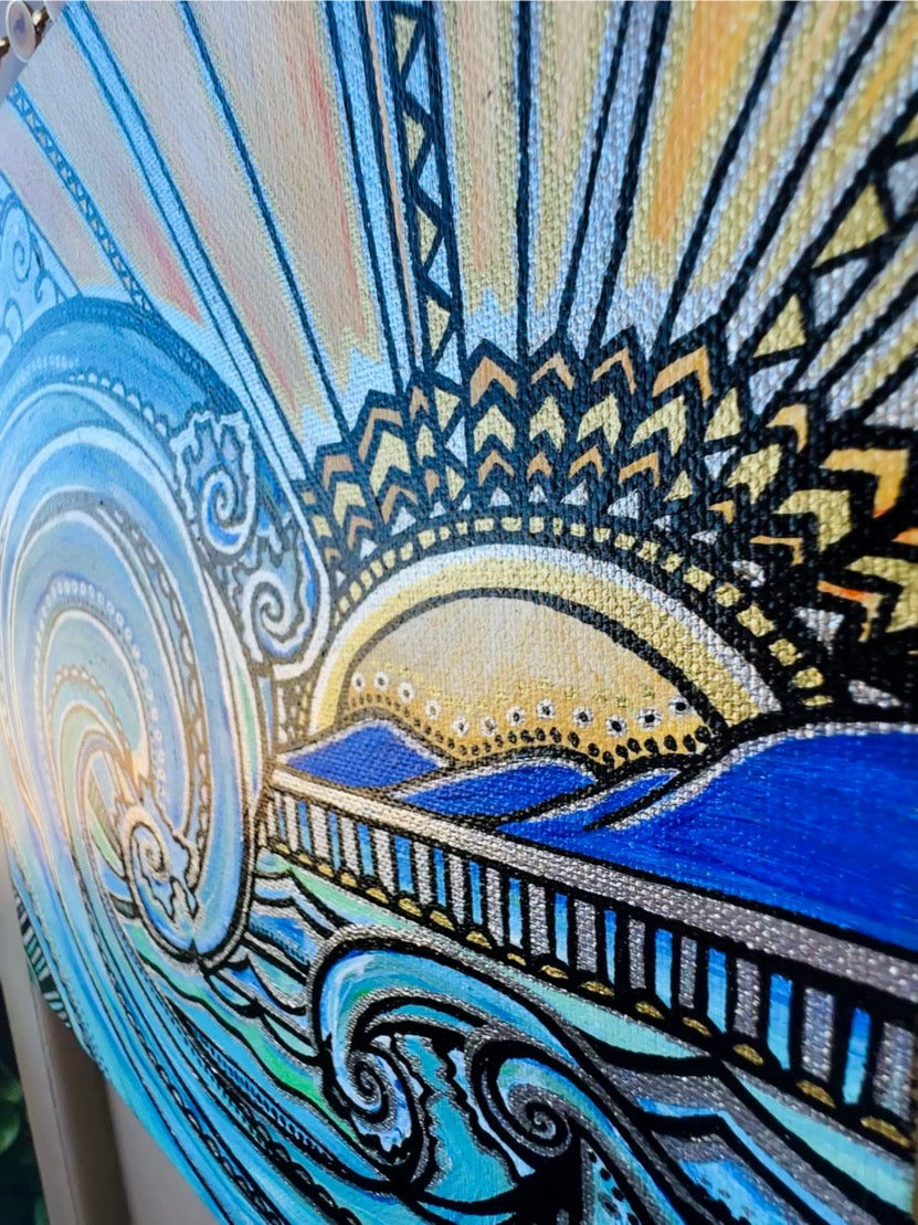 Decorative artwork with abstract patterns and a central sun-like shape.