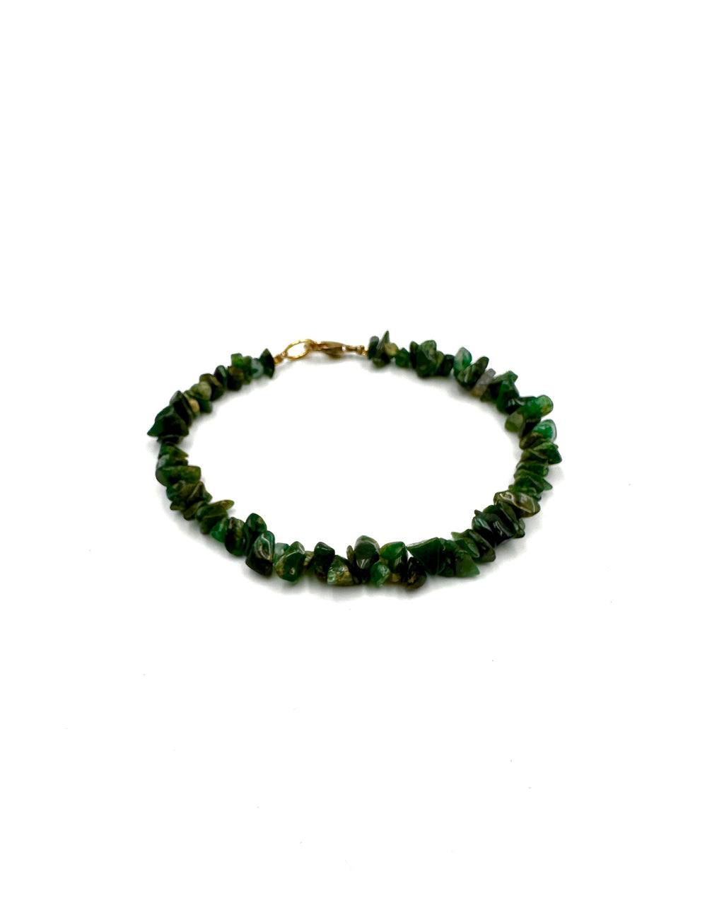 Green beaded bracelet on a white background