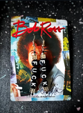 Earrings with 'FUCK' on a Bob Ross painting card
